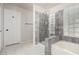 Bright bathroom featuring separate toilet and shower with tub and glass block accents at 4304 N Ranier --, Mesa, AZ 85215
