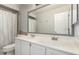 Bathroom features a dual sink vanity, toilet and shower with curtain at 4304 N Ranier --, Mesa, AZ 85215