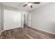 Spacious secondary bedroom has wood-look floors, closet and adjacent bathroom at 4304 N Ranier --, Mesa, AZ 85215