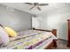 Relaxing bedroom features wood-look floors, ceiling fan and large closet at 4304 N Ranier --, Mesa, AZ 85215