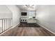 Spacious bonus room boasts wood floors, a ceiling fan, and includes built in desk for the perfect work space at 4304 N Ranier --, Mesa, AZ 85215