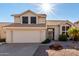 Charming two-story home with desert landscaping, tile roof, and an attached two car garage at 4304 N Ranier --, Mesa, AZ 85215
