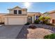 Charming two-story home with desert landscaping, tile roof, and an attached two car garage at 4304 N Ranier --, Mesa, AZ 85215