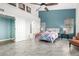 Primary bedroom with bright accent wall and tile flooring, illuminated by natural light at 4304 N Ranier --, Mesa, AZ 85215