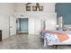 Bright main bedroom boasts double doors, high ceilings and beautiful marble-look tile flooring at 4304 N Ranier --, Mesa, AZ 85215