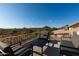 Enjoy serene desert views from this cozy patio with comfortable seating under a clear blue sky at 4304 N Ranier --, Mesa, AZ 85215