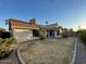 Backyard featuring a terracotta tile roof, desert landscaping, and patio area at 4332 E Frye Rd, Phoenix, AZ 85048