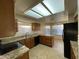 Well-lit kitchen featuring granite countertops, wooden cabinets, and black appliances at 4332 E Frye Rd, Phoenix, AZ 85048