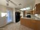 Functional kitchen with granite countertops, wooden cabinets, and modern black appliances at 4332 E Frye Rd, Phoenix, AZ 85048