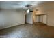 Spacious living room with tile flooring, a ceiling fan, and easy access to other rooms at 4332 E Frye Rd, Phoenix, AZ 85048