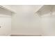 Walk-in closet has built-in shelving for optimal storage at 43949 W Sagebrush Trl, Maricopa, AZ 85138