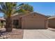 Charming single-story home with a desert landscape, two-car garage, and well-maintained front yard at 43949 W Sagebrush Trl, Maricopa, AZ 85138
