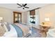 Cozy bedroom featuring a comfortable bed with soft blue accents, and large bright windows at 4525 N 66Th St # 10, Scottsdale, AZ 85251