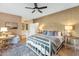 Bedroom featuring a comfortable bed, decorative walls, bedside tables, and bathroom entrance at 4525 N 66Th St # 10, Scottsdale, AZ 85251