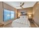 Bedroom featuring a comfortable bed, neutral decor, large windows, and hardwood floors at 4525 N 66Th St # 10, Scottsdale, AZ 85251