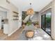 Elegant dining room with a stylish light fixture, and large mural. Perfect for gatherings at 4525 N 66Th St # 10, Scottsdale, AZ 85251