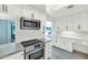 Charming kitchen featuring stainless steel appliances, light countertops, and bright white cabinetry at 4525 N 66Th St # 10, Scottsdale, AZ 85251