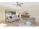 Inviting living room with a large window, vaulted ceilings, and comfortable seating creating a relaxing atmosphere at 4525 N 66Th St # 10, Scottsdale, AZ 85251