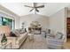 Bright living room featuring vaulted ceilings, neutral decor, and large windows providing natural light at 4525 N 66Th St # 10, Scottsdale, AZ 85251