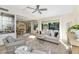 Open-concept living room with neutral decor, natural light, flowing into the adjacent dining area at 4525 N 66Th St # 10, Scottsdale, AZ 85251