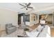 Open-concept living room connected to bar and dining area, perfect for entertaining and modern living at 4525 N 66Th St # 10, Scottsdale, AZ 85251