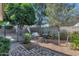 Serene patio with brick pavers, gravel, mature trees and decorative seating offering a private outdoor space at 4525 N 66Th St # 10, Scottsdale, AZ 85251