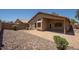 The backyard features low maintenance desert landscaping at 4605 W Beverly Rd, Laveen, AZ 85339
