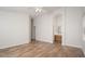 Bedroom with wood-look floors and archway view into the adjacent bathroom at 4605 W Beverly Rd, Laveen, AZ 85339
