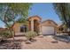 Single-story home featuring a front-facing two-car garage, a neutral-toned exterior and desert landscaping at 4605 W Beverly Rd, Laveen, AZ 85339