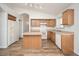 Well-lit kitchen featuring wood cabinets, tile flooring, and modern white appliances at 4605 W Beverly Rd, Laveen, AZ 85339