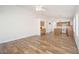 Open-concept living and kitchen area showcasing wood-look tile flooring and ample natural light at 4605 W Beverly Rd, Laveen, AZ 85339