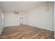 Spacious living room boasting vaulted ceilings, wood-look tile flooring, and a ceiling fan at 4605 W Beverly Rd, Laveen, AZ 85339