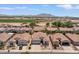 An aerial view of the property showcasing its proximity to mountains and surrounding neighborhood at 4649 E Sourwood Dr, Gilbert, AZ 85298