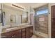 Bathroom boasts double sinks, granite counters, and a tiled walk-in shower at 4649 E Sourwood Dr, Gilbert, AZ 85298