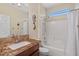 Bright bathroom features a shower-tub combination and granite countertops on the vanity at 4649 E Sourwood Dr, Gilbert, AZ 85298