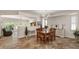 Bright dining room with modern chandelier and view to the living room and backyard at 4649 E Sourwood Dr, Gilbert, AZ 85298