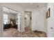 Open entryway featuring wood-look flooring and easy access to a bright home office space at 4649 E Sourwood Dr, Gilbert, AZ 85298