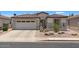 Charming single-story home with a well-maintained yard and a two-car garage at 4649 E Sourwood Dr, Gilbert, AZ 85298