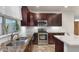 Close-up of a kitchen featuring granite countertops, stainless steel appliances, and modern cabinetry at 4649 E Sourwood Dr, Gilbert, AZ 85298