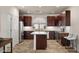 Modern kitchen with stainless steel appliances, center island, and beautiful backsplash at 4649 E Sourwood Dr, Gilbert, AZ 85298