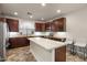 Bright kitchen with a large island, stainless steel appliances, and bar seating at 4649 E Sourwood Dr, Gilbert, AZ 85298
