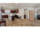 Spacious kitchen featuring a large island, dark wood cabinetry, and stainless steel appliances at 4649 E Sourwood Dr, Gilbert, AZ 85298