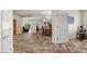 Spacious living room with a dining area, wood-look flooring and view to the backyard at 4649 E Sourwood Dr, Gilbert, AZ 85298