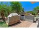 Backyard with covered grill and prep area, perfect for outdoor entertaining at 4649 E Sourwood Dr, Gilbert, AZ 85298