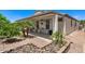 Covered patio overlooks rock garden and mature trees at 4649 E Sourwood Dr, Gilbert, AZ 85298