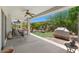 Covered patio overlooking well-manicured lawn and backyard at 4649 E Sourwood Dr, Gilbert, AZ 85298