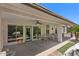 Covered patio overlooking well-maintained yard with mature trees at 4649 E Sourwood Dr, Gilbert, AZ 85298