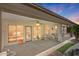 Inviting covered patio with outdoor dining set and views of the lush backyard at 4649 E Sourwood Dr, Gilbert, AZ 85298
