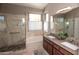 Bright bathroom with a soaking tub, walk-in shower, and double vanity at 5023 S Dusty Coyote Trl, Gold Canyon, AZ 85118