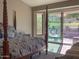 Primary bedroom with backyard access and golf course views at 5023 S Dusty Coyote Trl, Gold Canyon, AZ 85118